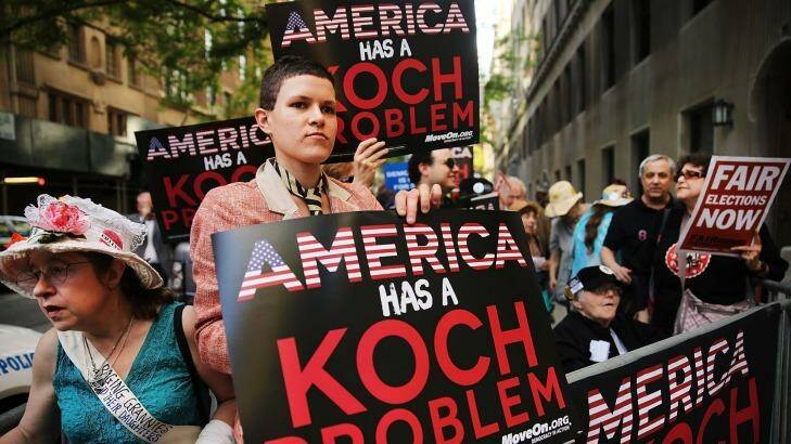 Activists hold a protest near the Manhattan apartment of billionaire and Republican financier David Koch in New York City last year.  Photo: Spencer Platt