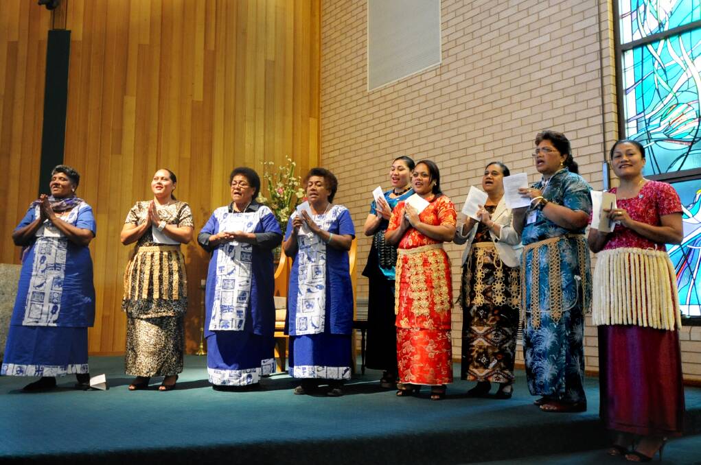 Associated Women of the World members from Fiji, Tonga and Papua New Guinea singing hymns in traditional dress.       Photo: LOUISE DONGES