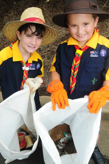 Blake Smith and Charlie Collins lent a hand in Clean Up Australia Day. Photo: KATHRYN O'SULLIVAN