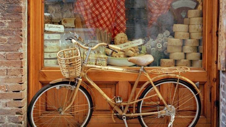 The slow pace of cycling allows plenty of time for sampling the produce in tiny towns along the way. Photo: Cultura RM/Philip Lee Harvey