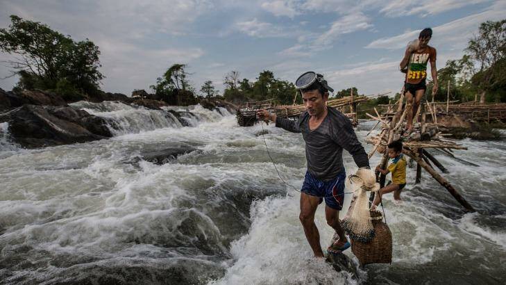 Fisherman are worried that the construction of the Don Sahong Dam will disrupt the flow the Mekong and migration of fish.    Photo: Jason South