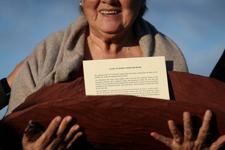 Pat Anderson from the Referendum Council with a piti holding the Uluru Statement from the Heart, during the closing ceremony in the Mutitjulu community of the First Nations National Convention held in Uluru, on Friday 26 May 2017. fedpol Photo: Alex Ellinghausen