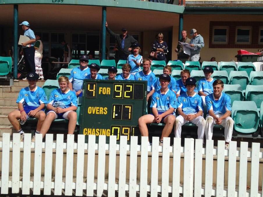 The victorious Dubbo side pose with the scoreboard after defeating Mid North Coast in the final.  
Photo: contributed