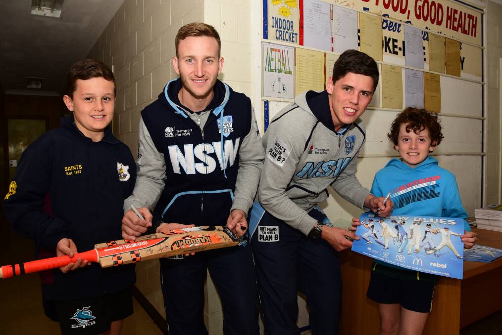 Ryan and Angus Boland with NSW cricketers Peter Nevill and Ben Dwarshuis at Dubbo Sports World on Thursday. 	Photo: BELINDA SOOLE