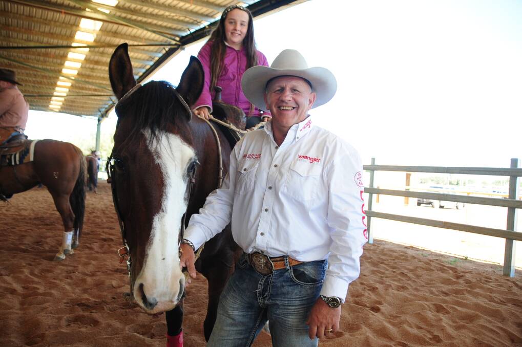 Rick Sciberras from Mendooran and granddaughter Kasey Bogie astride Boonsmapetos at the Dubbo Showground for the Reining on the Plains event. 			      Photo: CHERYL BURKE