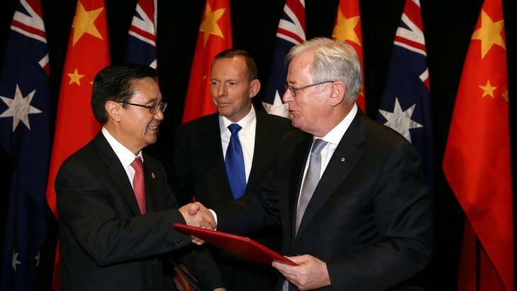 Chinese Commerce Minister Gao Hucheng, former prime minister Tony Abbott and Trade Minister Andrew Robb at the signing of the China-Australia free trade agreement in June.  Photo: Alex Ellinghausen