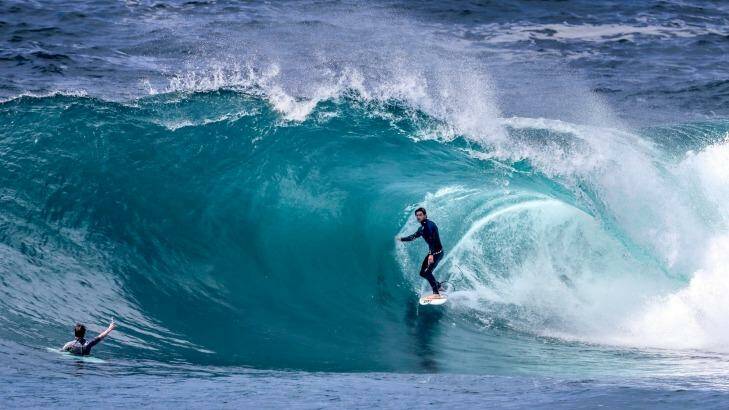Pro surfer Perth Standlick stands tall in a clean barrel at Cape Solander on Wednesday. Photo: Dallas Kilponen