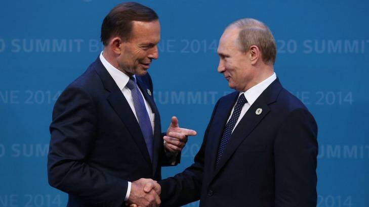 Tony Abbott welcomes Vladimir Putin to the G20 in Brisbane in September last year after threatening to shirt-front the Russian President. Photo: Andrew Meares