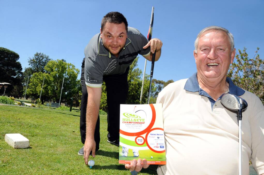 Jake O Brien from Dubbo Golf Club with Ivor Trapman, who is organising this year s Bullseye Championships. 			       Photo: BELINDA SOOLE