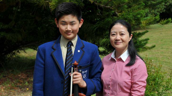 Knox Grammar music scholarship student Kevin Fan with his mother Vivian Rong Xu.  Photo: Supplied