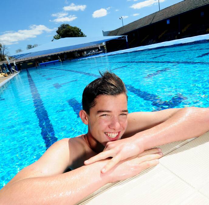 Dubbo Aquatic Leisure Centre employee Joden Wilson takes the first dip of the swim season. 							Photo: LOUISE DONGES