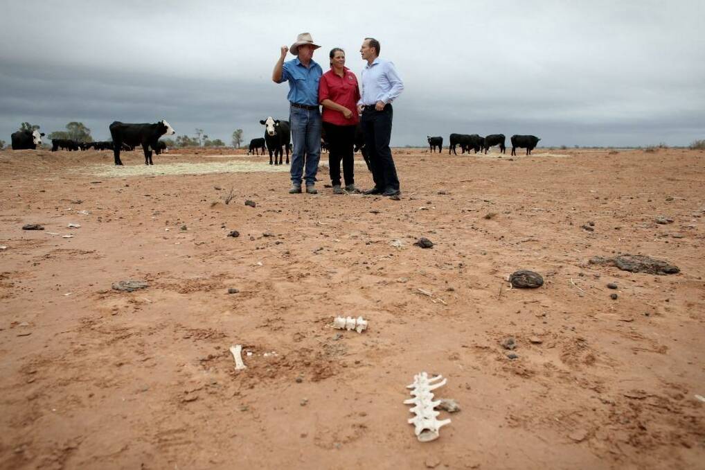Bourke locals with Prime Minister Tony Abbott in February Photo: Andrew Meares