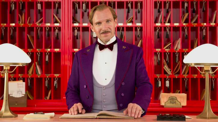 Ralph Fiennes at the front desk in The Grand Budapest Hotel.