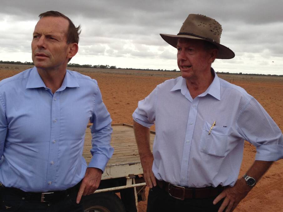 Former Prime Minister Tony Abbott and Parkes MP Mark Coulton on a visit to Walgett and Lightning Ridge in 2014. 	Photo: CONTRIBUTED