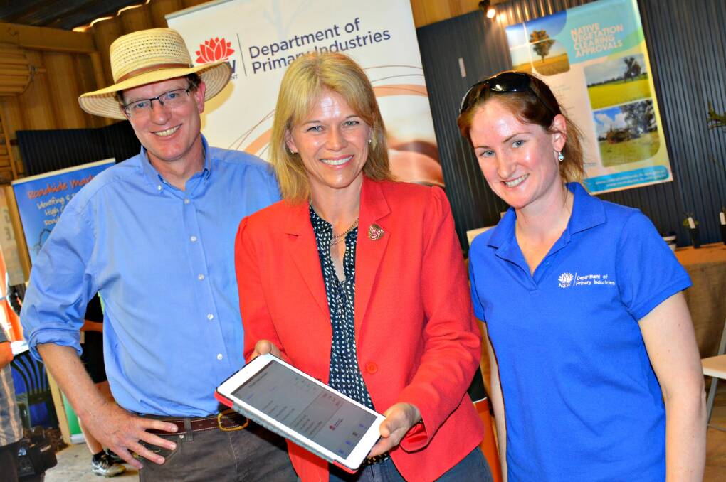 RIGHT: Orange MP Andrew Gee, Minister for Primary Industries Katrina Hodgkinson and DPI beef development officer Patricia O'Keefe launching the new Drought Feed Calculator app at the Australian National Field Days.