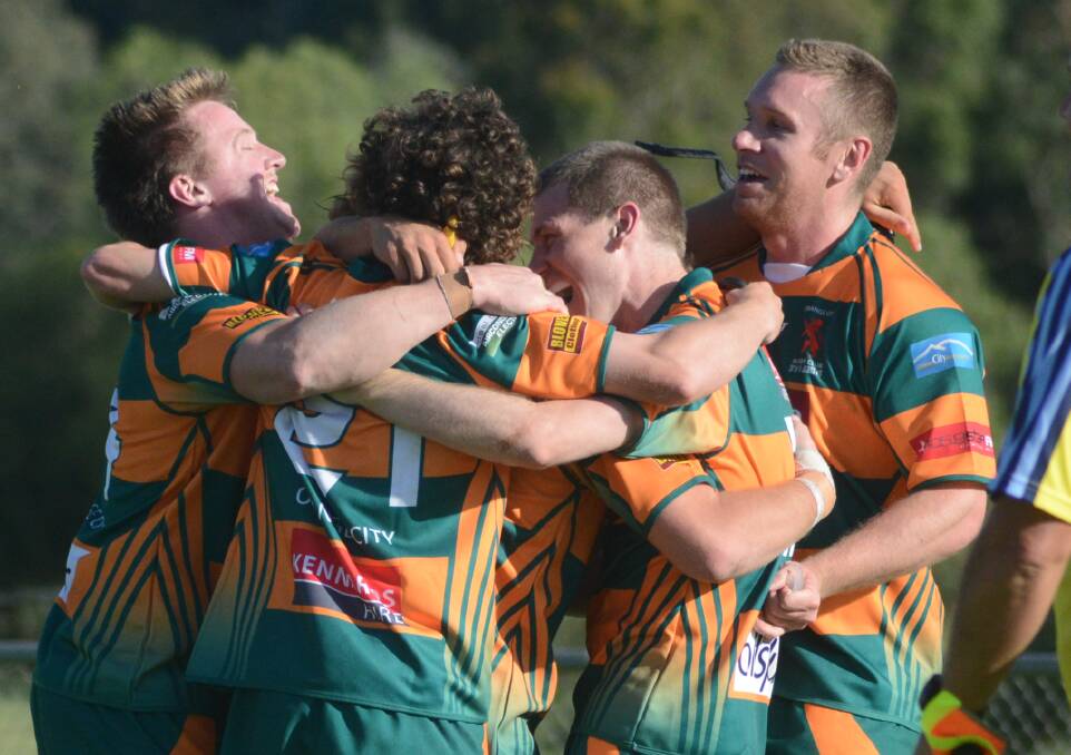 ORANGE CITY: The Lions celebrate the last-minute try that secured them the game at Northparkes Oval on Saturday.