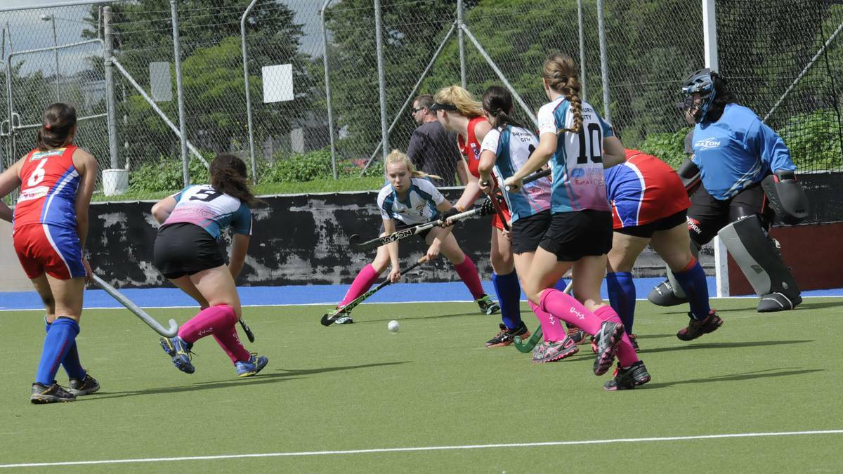 CITY COMFORT: Bathurst City's Ivy Moore about to strike during her side's 6-1 win over Orange Confederates in round five of the women's Premier League Hockey competition at the Cooke Hockey Complex on Saturday. Photo: PHILL MURRAY
