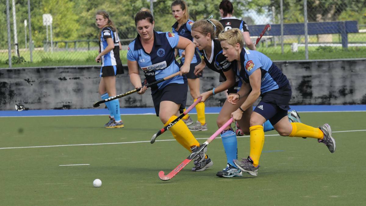 SOUTH TO VICTORY: Bathurst Souths' Nikki Braun and Ashleigh Corby team up on Lithgow Zig Zag'sKeely Hunter during Saturday's women's Premier League Hockey game at the Cooke Hockey Complex on Saturday. Photo: PHILL MURRAY