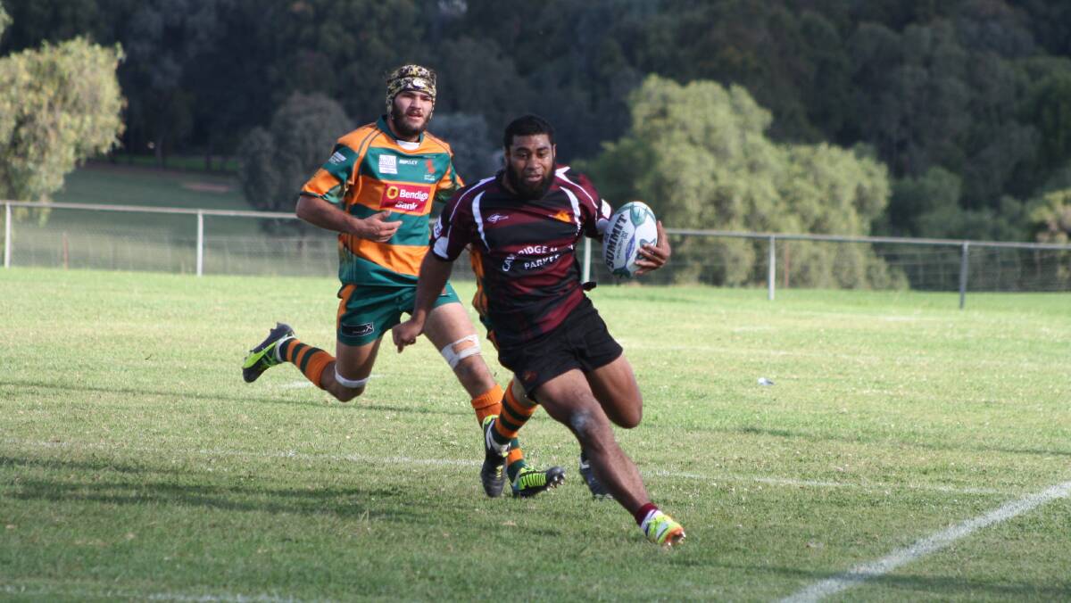 PARKES BOARS: Fly-half Mahe Fangupo finds some open space. Photo: MICHELLE COOK