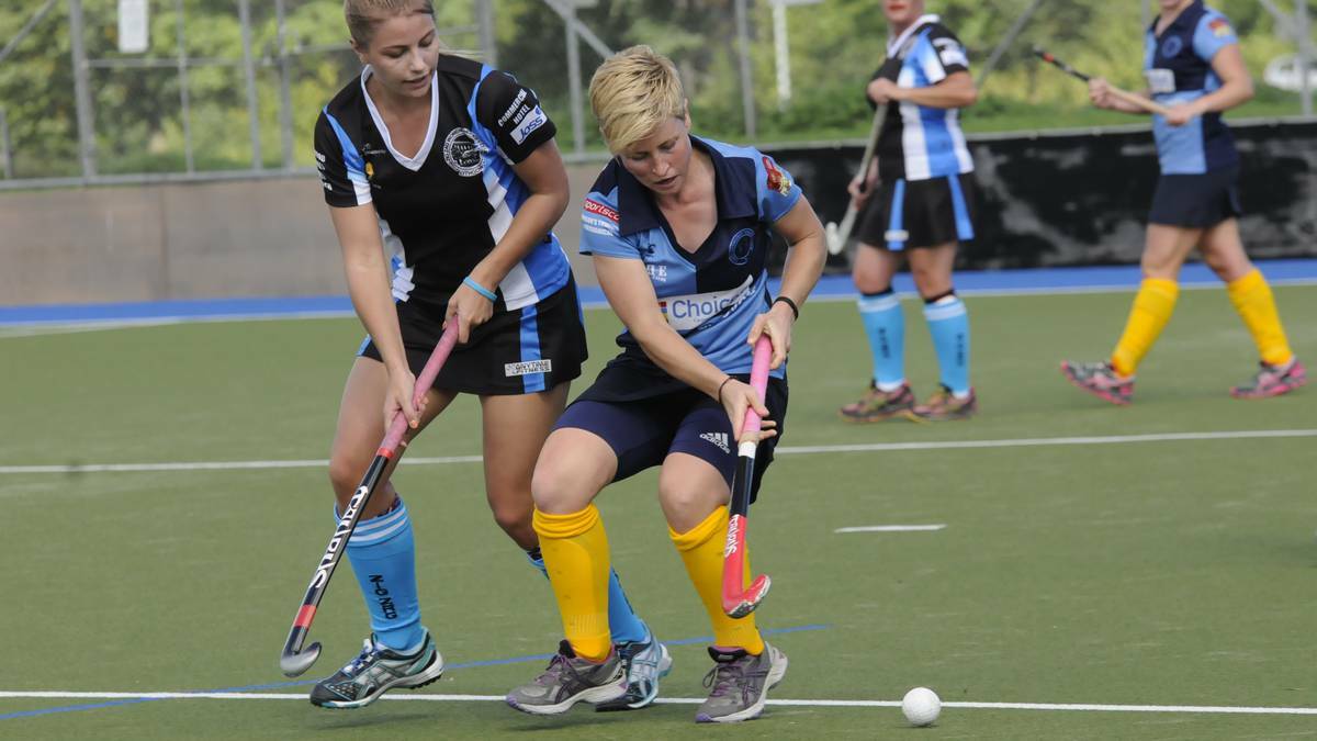 SOUTH TO VICTORY: In the thick of the action on Saturday were Bathurst South's Ashleigh Corby Lithgow Zig Zag's Keely Hunter. Photo: PHILL MURRAY