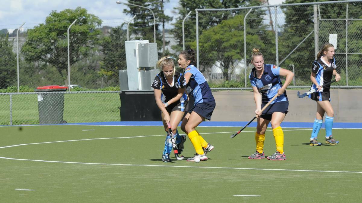 SOUTH TO VICTORY: Keely Hunter and Tahlia Cranston come together during Bathurst Souths 2-0 defeat of Lithgow Zig Zag at the Cooke Hockey Complex on Saturday. Photo: PHILL MURRAY