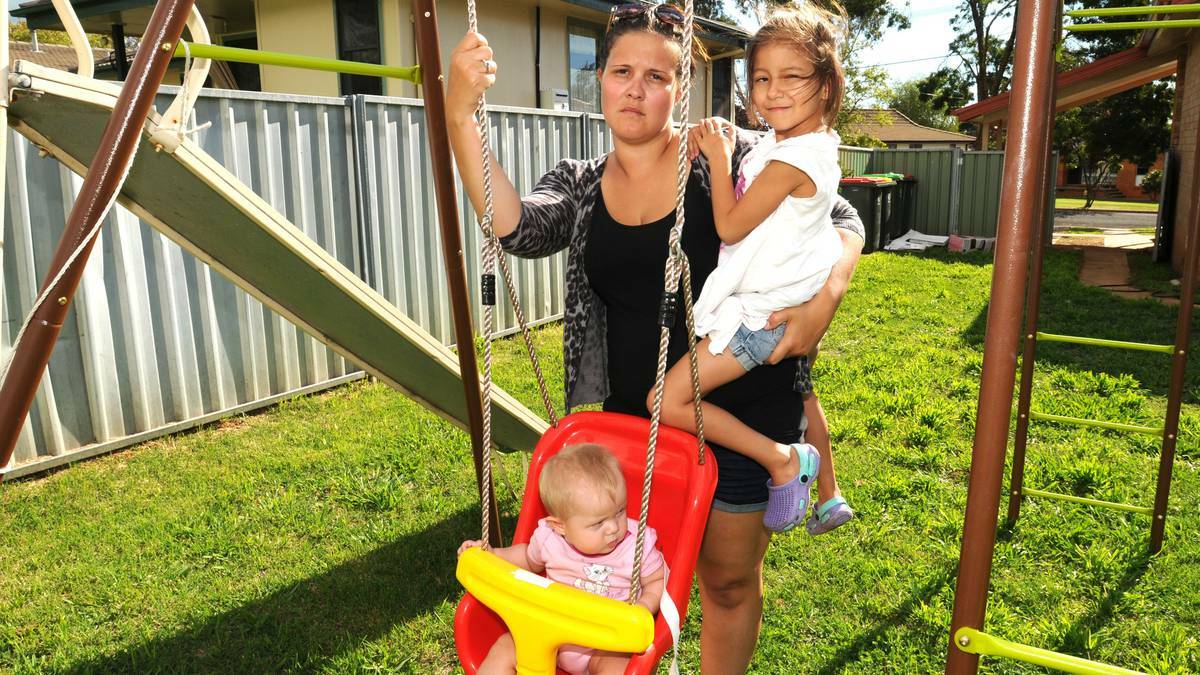 ORANGE: Crystal Webb, with her children Riley Firth and Sophia Oakes, is horrified someone could take away her independence after her car was stolen and destroyed on Thursday night. Photo: STEVE GOSCH 0321sgcar1