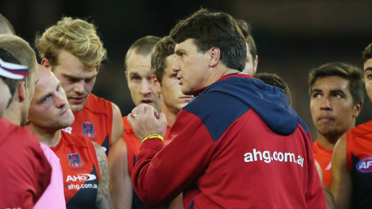 Paul Roos, coach of the Demons, talks to his team. Picture: Getty Images.