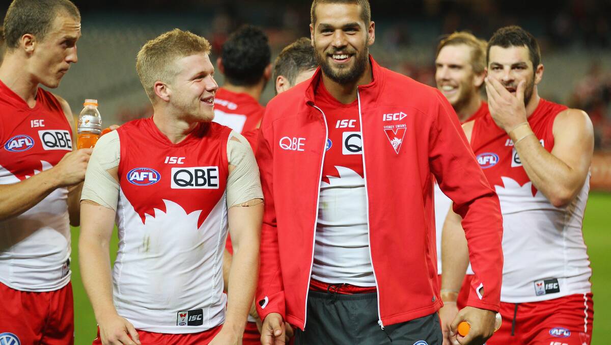Daniel Hannebery and Lance Franklin of the Swans leave the field. Picture: Getty Images.