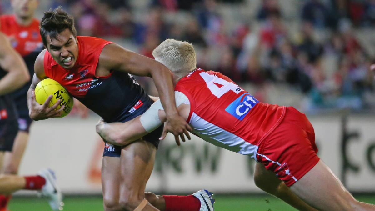 Jay Kennedy-Harris of the Demons is tackled by Daniel Hannebery of the Swans. Picture: Getty Images. 