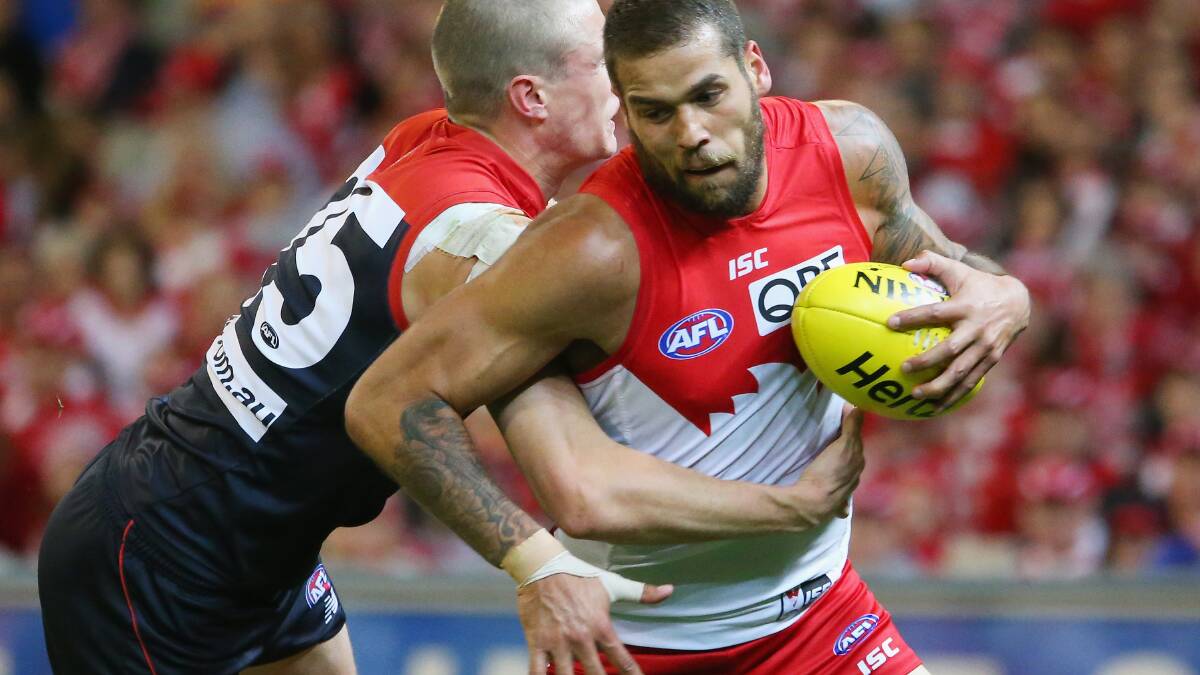 Lance Franklin of the Swans is tackled by Tom McDonald of the Demons. Picture: Getty Images.