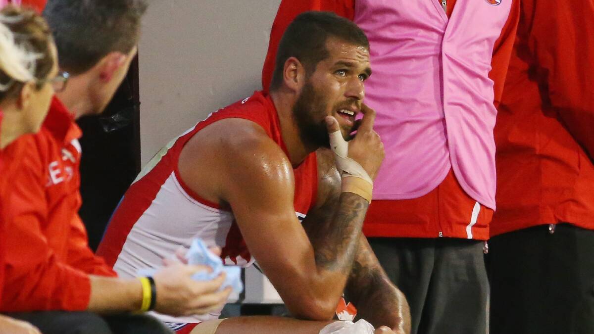 Lance Franklin of the Swans sits on the bench injured with ice on his knee. Picture: Getty Images.