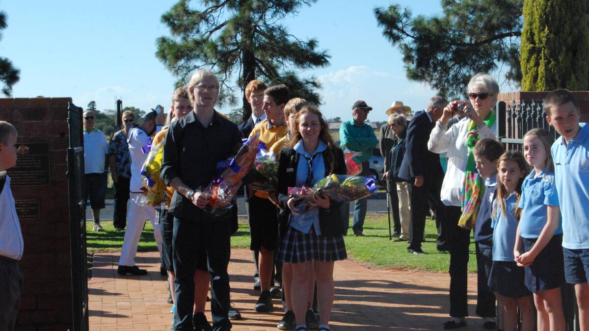 THE WAR CEMETERY SERVICE: Vice Captains of Narromine Public School lead the procession