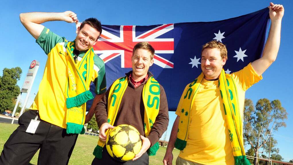 Alan Auld, Rhys and Leigh Osborne of Macquarie United Football Club gear up for the World Cup.