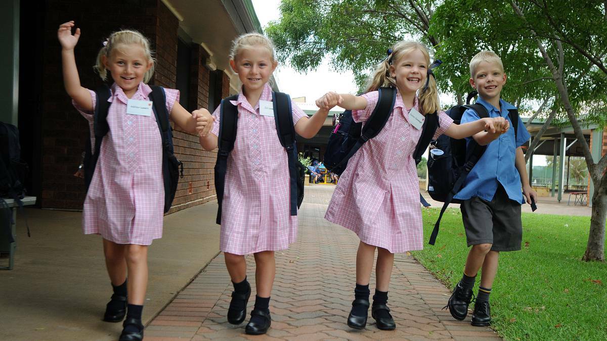 Addison and Zali Lovett with Sienna and Harry Cavanagh at their first day of school yesterday. Photo: BELINDA SOOLE