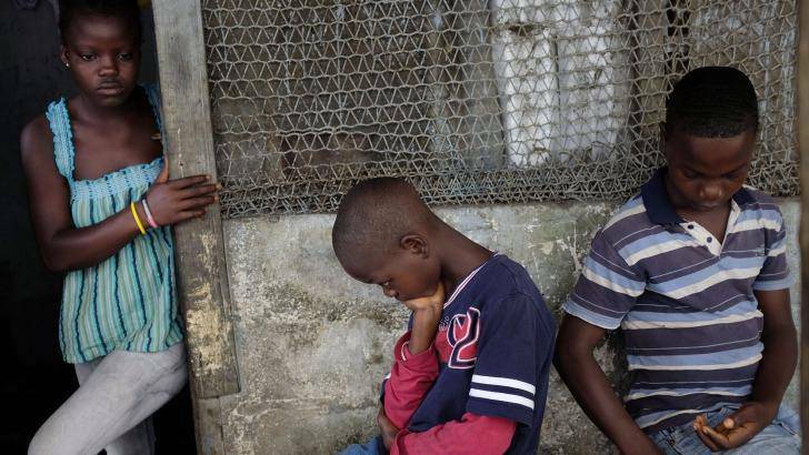 Orphans Promise,16, Emmanuel jnr, 11, and Benson Cooper, 15, at their home in Monrovia, Liberia, after losing their parents to Ebola.