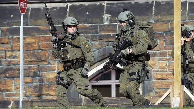 Members of a Royal Canadian Mounted Police intervention team responds to a shooting at the parliament buildings in Ottawa. Photo: AP