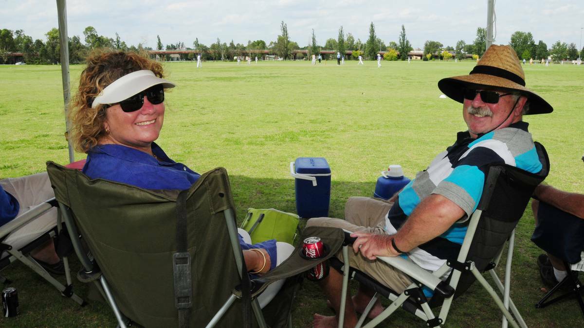 Cathy Korn of Kempsey and Phil Palmer of Alstonville take to the shade during the opening match of the State Challenge Cricket tournament in Dubbo on Monday. Photo: HANNAH SOOLE.