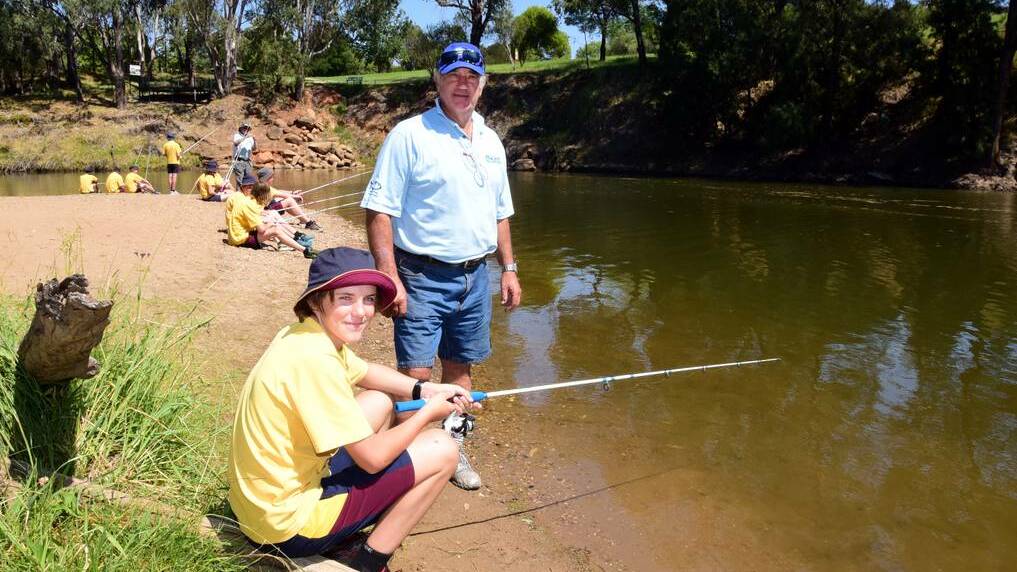 St John's student Jack Brown with Fishcare volunteer Charlie Haynes on the Macquarie River. Photo: BELINDA SOOLE