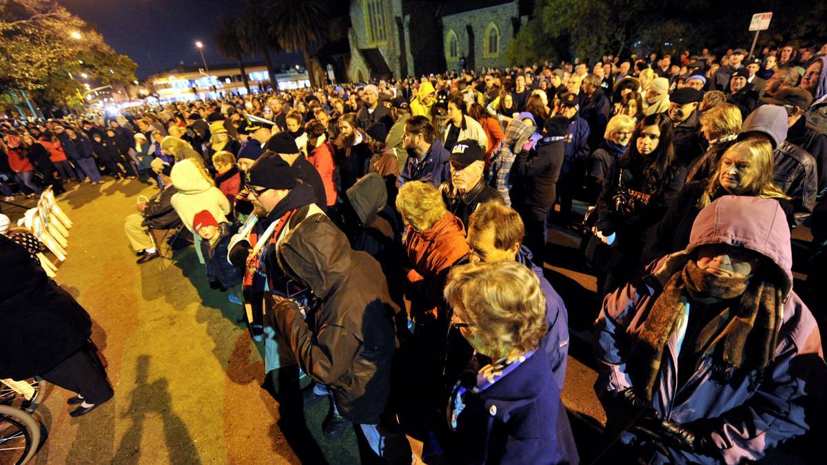 BALLARAT: Crowds watch on at the Cenotaph on Friday morning. Photo: Jeremy Bannister, The Courier. 
