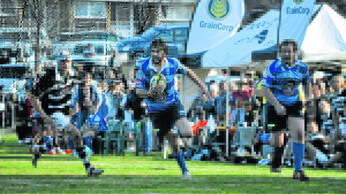 RAM RAID: Brock Syphers charges down the touchline for the Rams.
Photo: NICK McGRATH 0830nmmolong23