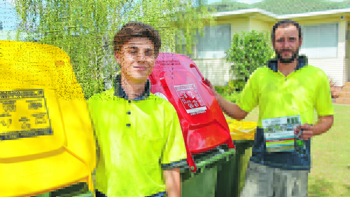 BIN DROP: Mastel employees Mario De Bruijn and Vincent Nesterenko drop off new bins to Orange residents. Photo: SUPPLIED
