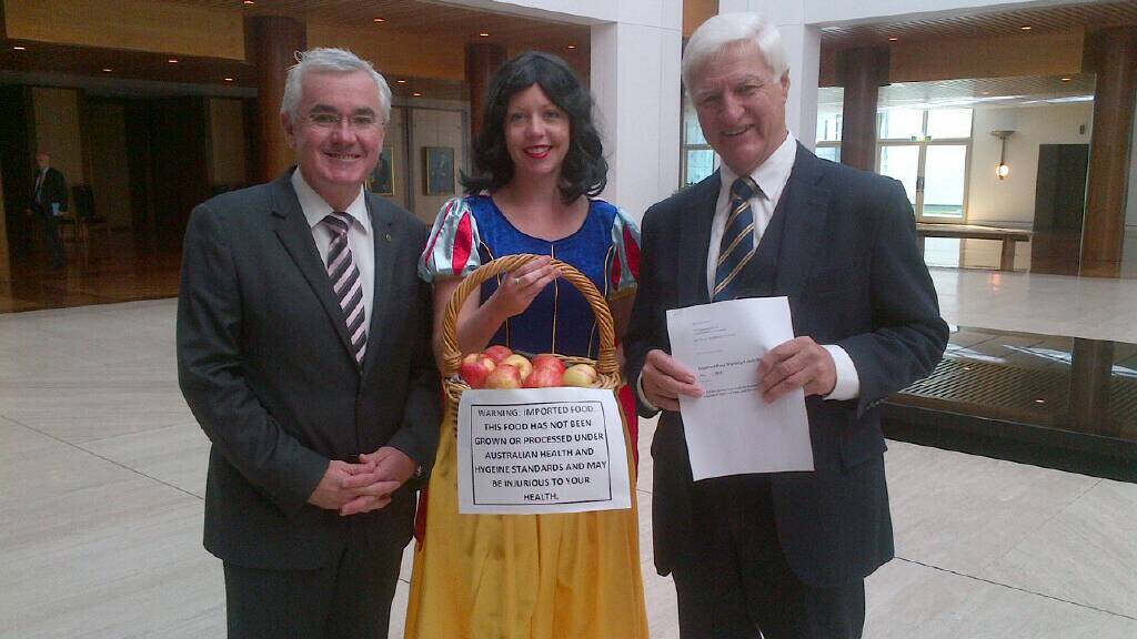FOOD SAFETY: Mr Katter, Member for Denison Andrew Wilkie and Snow White. 
Picture:  Anne Pleash.
