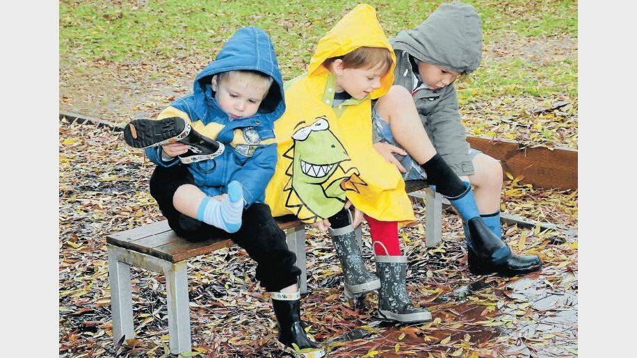JUNE: Gearing up for wet weather play at Dubbo's Rainbow Cottage childcare centre were Austin Reynolds, Angus Mein and Tate Wootton.
Photo: LOUISE DONGES
