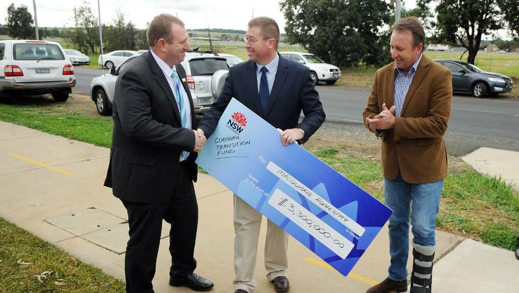 In 2014 Macquarie Homestay's bank account was boosted by a $3.3 million grant from the state government's Restart NSW Cobbora Transition Fund,. Macquarie Homestay volunteer chairman Rod Crowfoot wass presented the cheque by Dubbo MP Troy Grant and Barwon MP Kevin Humphries. Photo: BELINDA SOOLE