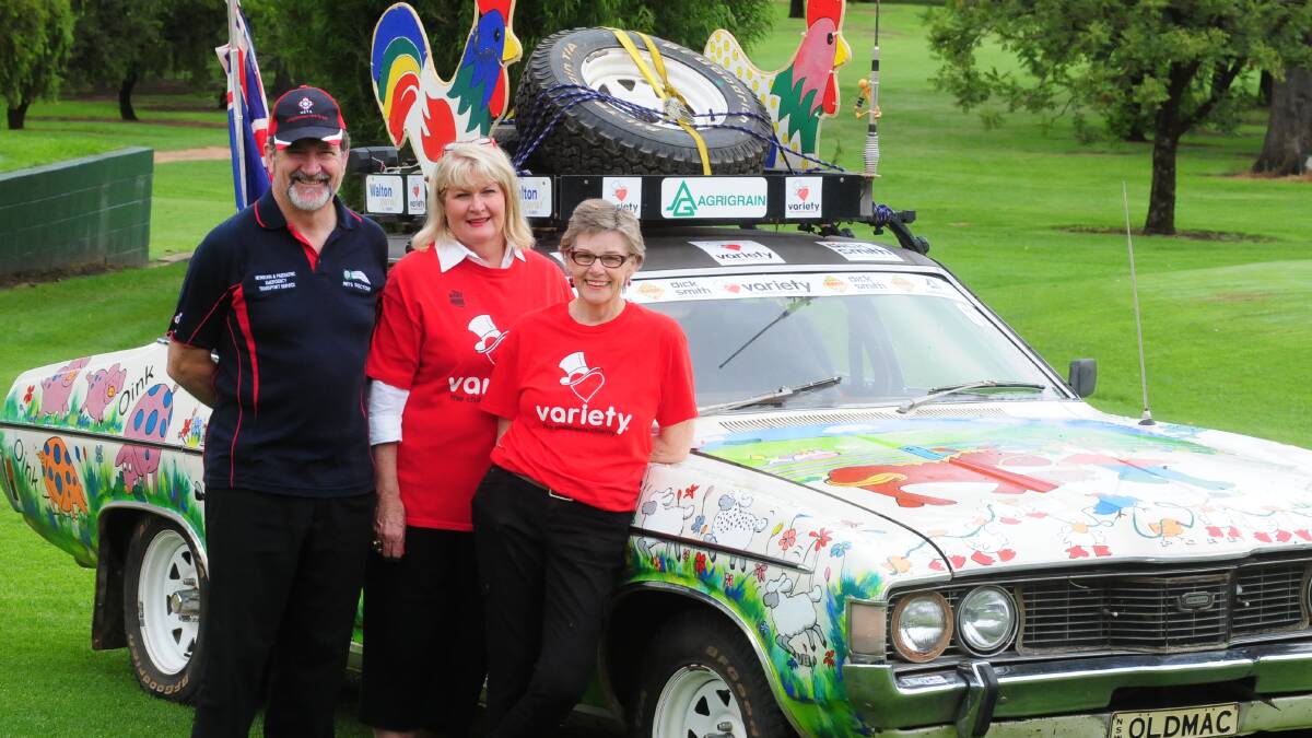 VARIETY CHARITY GOLF DAY:  Dr Andrew Berry with Bash Car Entrants Lee Estens and Pauline Meers. Photo: LOUISE DONGES