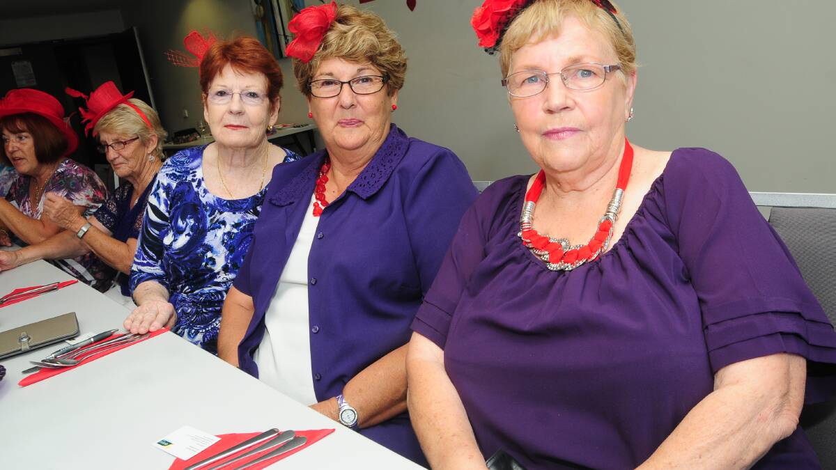 RED HAT LADIES: Dorothy Hing, Heather Amor and Betty Bruce. Photo: JOSH HEARD.