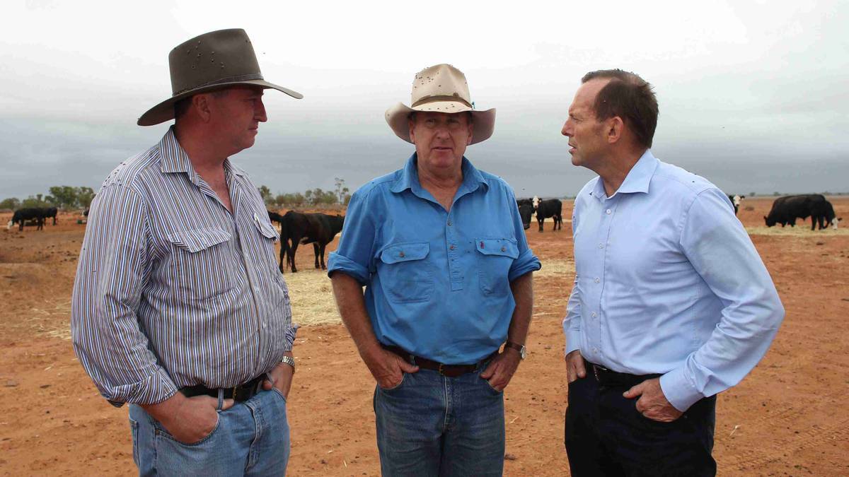 Prime Minister Tony Abbott meets graziers Phillip Ridge of 'Jandra', near Bourke, as part of a drought tour with Agriculture minister Barnaby Joyce during early 2014. Picture: Getty Images