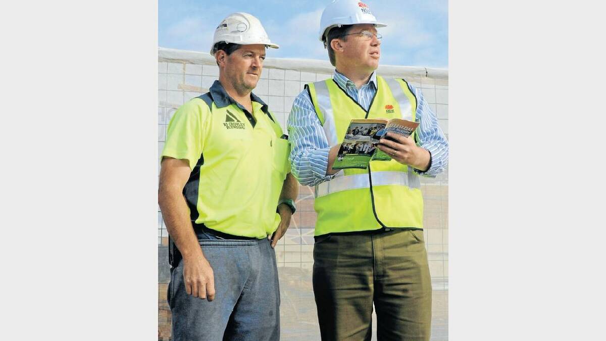 MAY: Dubbo MP Troy Grant (right) briefs Brendan Crowley of BJ Crowley Plumbing on the planned resumption of the early works for stage one and two redevelopment of Dubbo Base Hospital. The business is owed $440,000 for work previously carried out on the site. Photo: BELINDA SOOLE