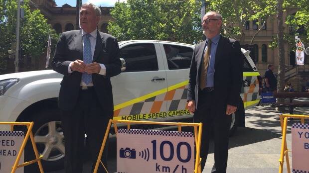 The NSW Roads Minister Duncan Gay announces new high visibility paint jobs for mobile speed camera vehicles and new signs to warn motorists they are about to be checked. Photo: Anne Davies

