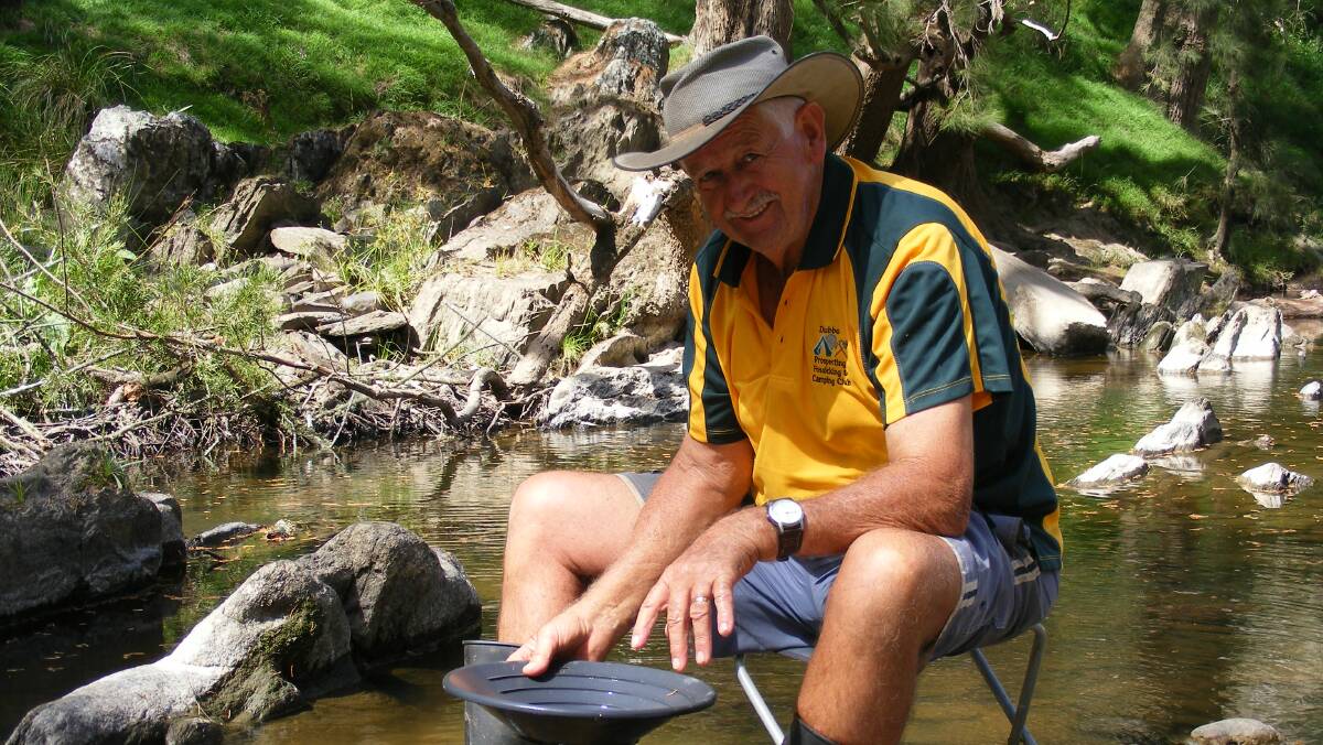 One of the many summer camping trips taken by the Dubbo Prospecting, Fossicking and Camping Club. Brian Gibbons gold panning at Ophir.  Photo: Brian Walters